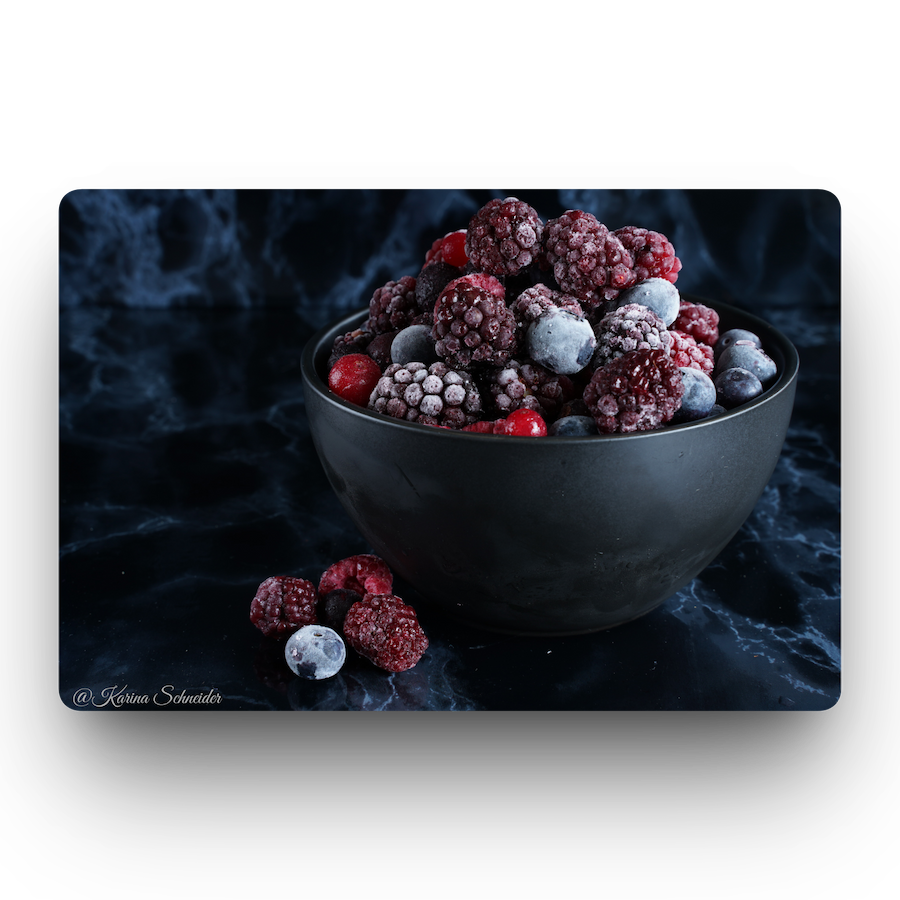 Frozen fruit in a black bowl
